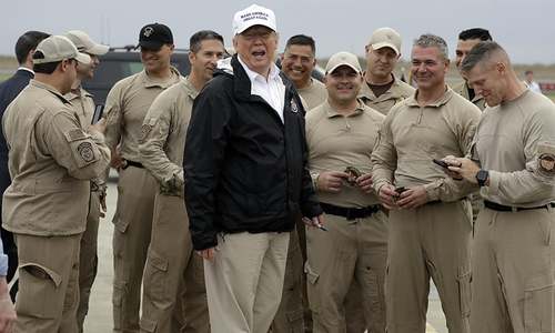 Trump pushes wall plan in US-Mexico border visit