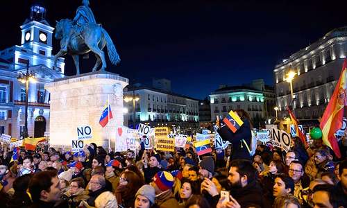 Rival rallies begin in tense Venezuela as air force general defects