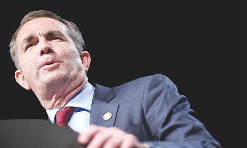 Virginia governor apologises for racist photo but resists growing calls to quit