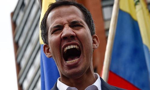 Venezuela's Guaido warns military on blocked aid