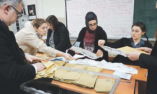 Turks vote in test for Erdogan as recession hits home