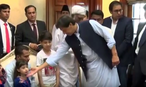 PM Khan gives cheques worth Rs30m to family of Sahiwal 'encounter' victims PM Khan gives cheques worth Rs30m to family of Sahiwal 'encounter' victims