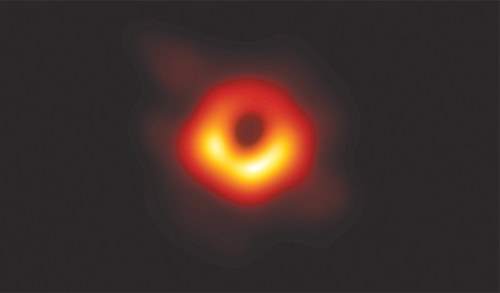 Scientists reveal first photo of black hole