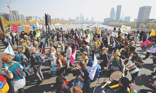 Thousands block London roads to demand action on climate change Thousands block London roads to demand action on climate change