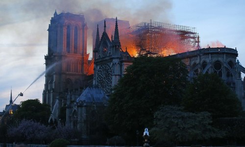 Notre-Dame fire under control after 9 hours, Macron vows 'cathedral will be reborn'