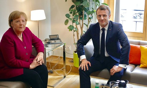 Macron confronts Merkel as fight for top EU job begins