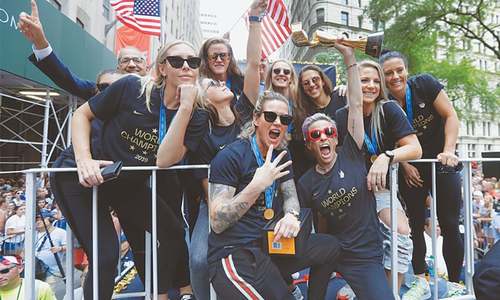 Confetti and chants of &lsquo;equal pay&rsquo; greet US World Cup winners