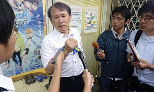 Hideaki Hatta, centre, president of Kyoto Animation speaks to the media. — Kyodo News via AP