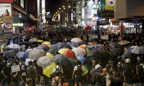 Hong Kong strike sinks city into chaos as leader vows to stay