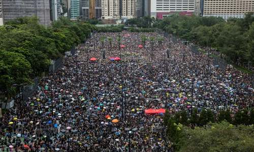 Hong Kong protesters flood city streets in 'peaceful' march