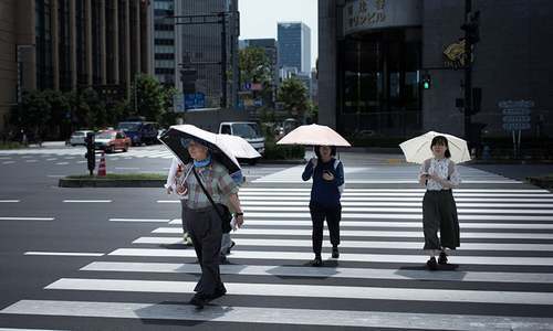 Two dead as Japan orders 670,000 to flee heavy rains