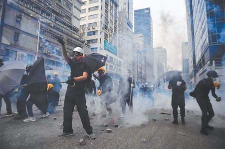 Hong Kong police round up activists as major protest called off