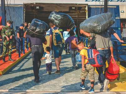 Hundreds of migrants moved from overcrowded Greek island