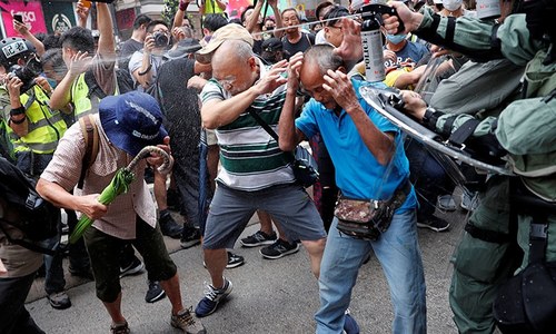Hong Kong police fire tear gas at protesters in shopping district Hong Kong police fire tear gas at protesters in shopping district