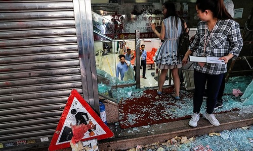 Hong Kong mops up after 180 arrested in violent National Day protests