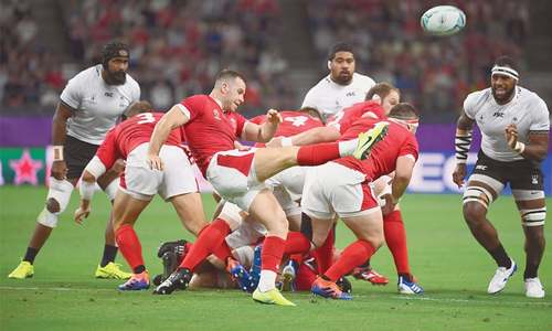 As typhoon nears, Wales weather Fiji storm to reach World Cup quarter-finals