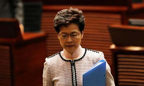 Hong Kong leader abandons policy speech after heckles from lawmakers
