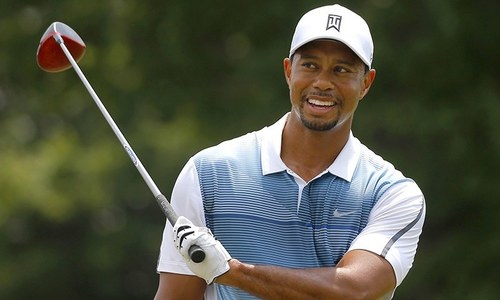 Tiger roars back after shaky start to lead in Japan