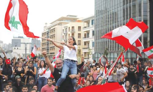 Lebanese take to streets for 10th day, defying Hezbollah