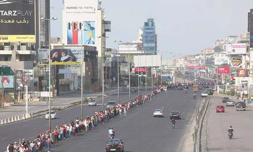 Lebanese protesters form 170-km nationwide human chain