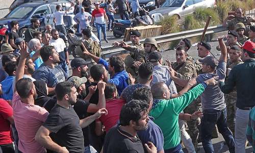 Lebanon reopens but crisis remains after PM resigns