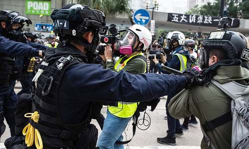 Officers beaten after police disband Hong Kong democracy rally