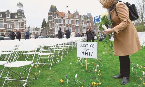 Relatives of plane crash victims protest Russian attitude with 298 empty chairs Relatives of plane crash victims protest Russian attitude with 298 empty chairs