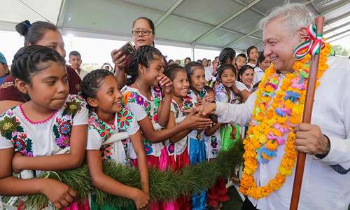 Mexico's President Andres Manuel Lopez Obrador shakes hands with girls while visiting towns in the southwestern state of Guerrero. — Reuters