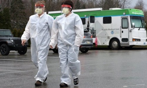 US locking down 70 million people as virus strains Europe