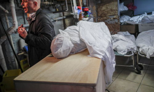 'Surreal': NY funeral homes struggle as virus deaths surge