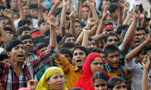 Bangladesh garment workers pack streets to demand wages during lockdown