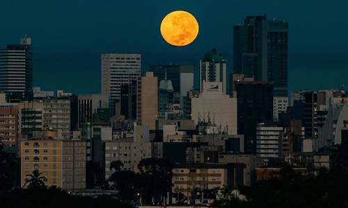 In pictures: Last supermoon of 2020 rises on a world grappling to overcome pandemic