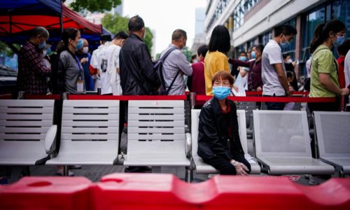 Crowds at Wuhan clinics fear coronavirus testing could rekindle disease