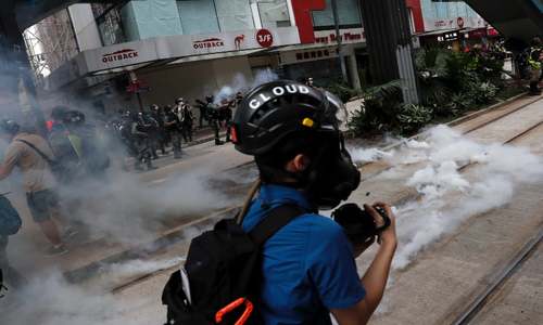 Hong Kong police fire tear gas on biggest protests since virus curbs