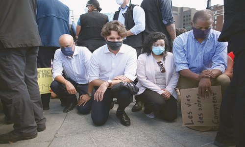 Trudeau attends anti-racism rally and takes a knee