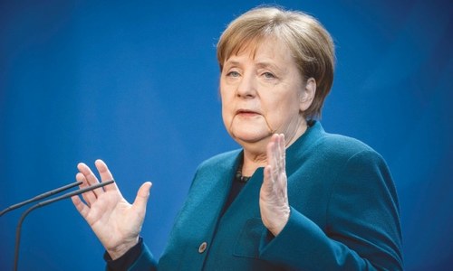 Taking EU helm, Germany&rsquo;s Merkel calls on Europe to show resolve
