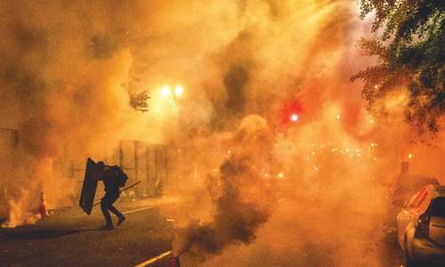 Protests tackle racism and federal crackdown in US city Portland