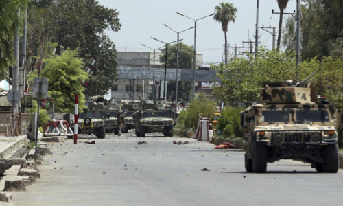 Islamic State attack on Afghan prison, killing 21, rages on