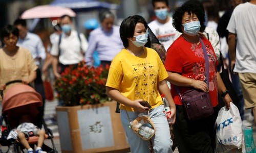 Beijing says residents can go mask-free as China Covid cases hit new lows