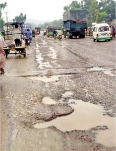 Potholes disrupt traffic on G.T. Road after rainfall Potholes disrupt traffic on G.T. Road after rainfall