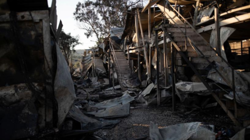 Greece accuses migrants of deliberately burning their camp