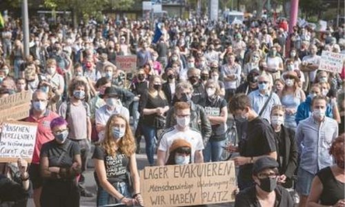 Thousands march in Germany urging EU to take in refugees