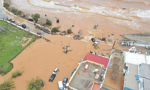 Floods sweep cars into sea, send people to rooftops in Greece
