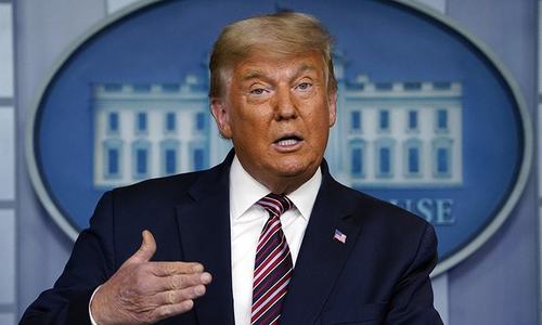 Trump, still not conceding defeat, trumpets vaccine progress