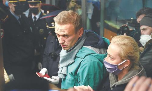 Kremlin critic Navalny detained after landing in Moscow