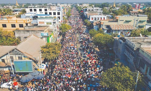 Myanmar army suspends laws limiting forces, hunts protest backers Myanmar army suspends laws limiting forces, hunts protest backers
