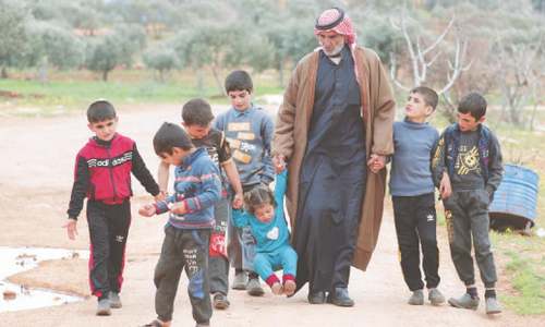 Syrian &lsquo;father of martyrs&rsquo; raises orphaned grandchildren