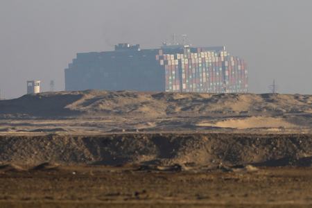 Suez Canal Authority says stranded ship partially refloated