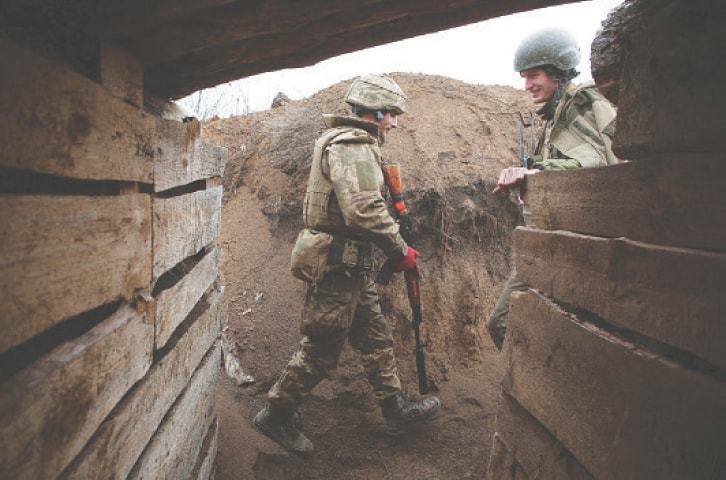 Ukraine&rsquo;s president visits frontline; Merkel urges Putin to pull back troops
