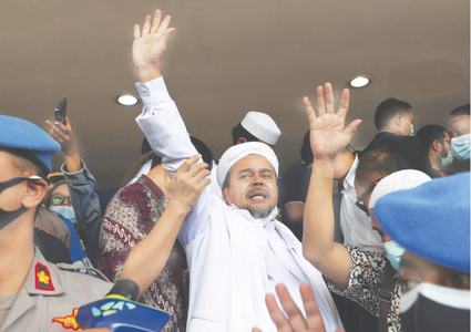 Indonesia court gives hardline cleric jail term for flouting Covid-19 curbs